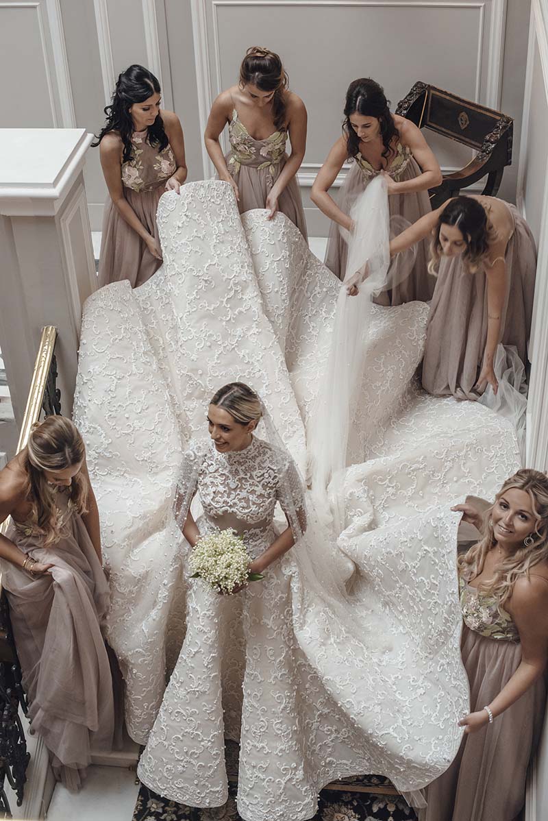 bridesmaid holding hem for the bride bridesmaid holding hem for the bride