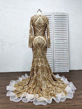 closed back gold sequin prom dress with white ruffle trim