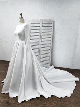white jersey and satin wedding gown with three quarters sleeves white jersey and satin wedding gown with three quarters sleeves