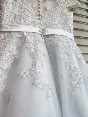 white lace appliqued white bridal dress