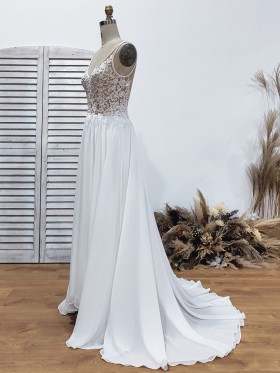 A line long lace and chiffon wedding gown with court train