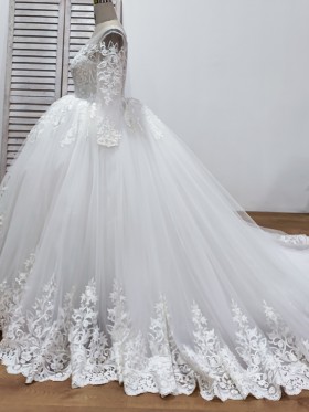 long sleeve ivory lace and tulle ball gown wedding dress