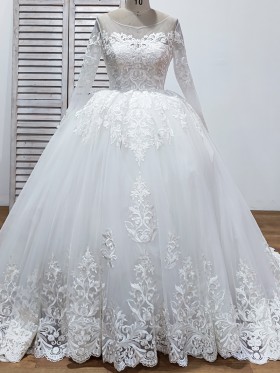 sequinned lace and tulle sleeved ball gown wedding dress