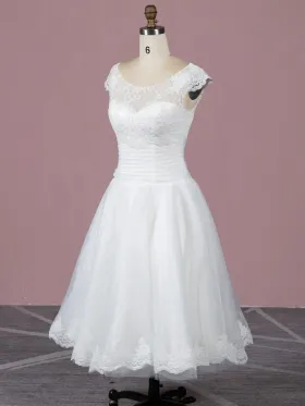 illusion neckline with lace cap sleeve tea length bridal gown
