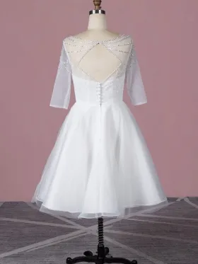 beaded three quarter length sleeve open back tea length dress beaded three quarter length sleeve open back tea length dress