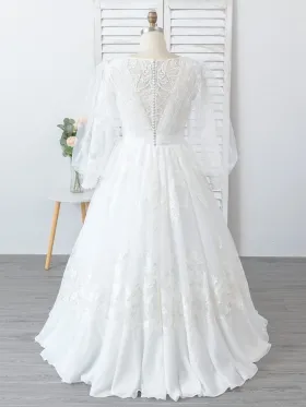 ruffled hemline and sheer sleeve wedding ball gown