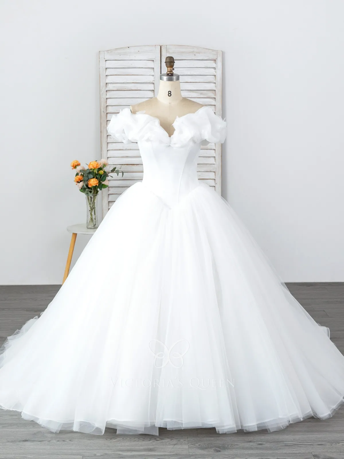 white ruffled organza Cinderella ball gown wedding dress