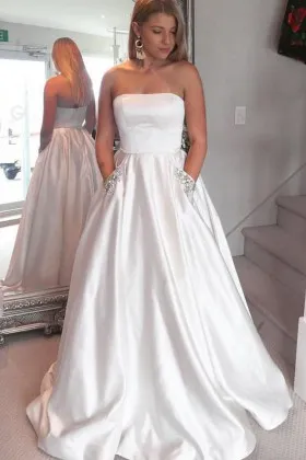 Strapless pure white satin floor length prom ball gown with beaded side pockets