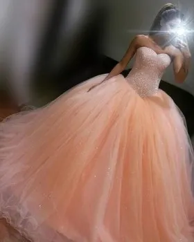 Sparkly beading and sequinned peach tulle ball gown with basque waist