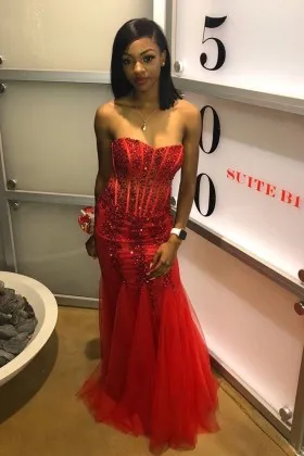 Dramatic beaded red satin and tulle strapless prom gown