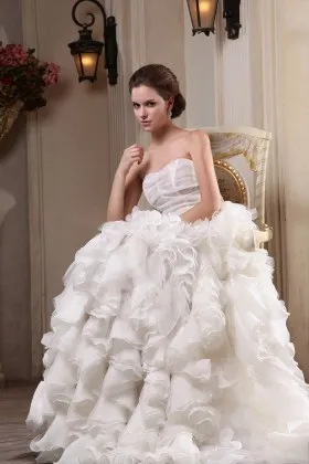 Subtle ivory cascading ruffled organza strapless sheath long wedding gown