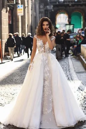 plunging neck cap sleeve wedding dress with overskirt