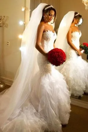 cascading ruffled mermaid lace and organza wedding gown