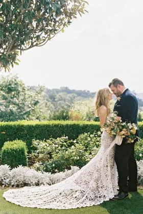 Ivory hollow lace mermaid chapel train wedding dress
