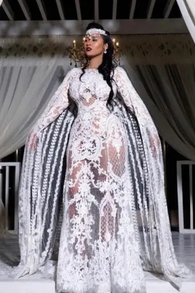 ultra alluring sheer lace bridal dress with unique cape