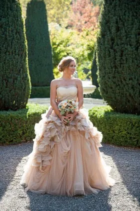 Cascade ruffled champagne tulle strapless outdoor wedding ball gown