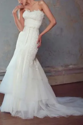 generous and unique ivory strapless mermaid lace and tiered tulle wedding dress