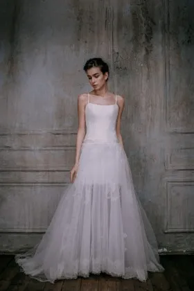 White sheer lace and tulle bridal dress with spaghetti straps