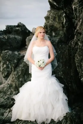 beaded ivory organza curved strapless ruched trumpet ruffled spring wedding dress