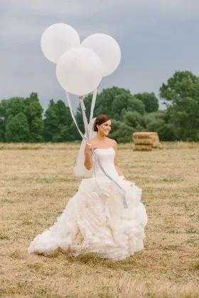 curved strapless ivory ruffled organza destination wedding gown