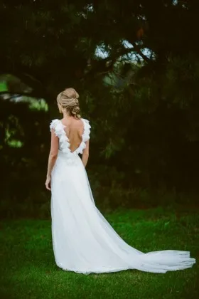 white tulle ruffled open v back and v neck destination wedding gown