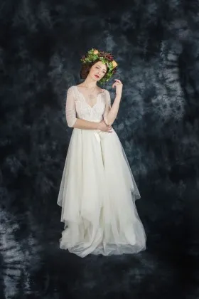 Glamorous cream lace and tulle scalloped V neckline half sleeve wedding gown