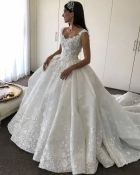 floral appliqued romantic ivory ball gown wedding dress