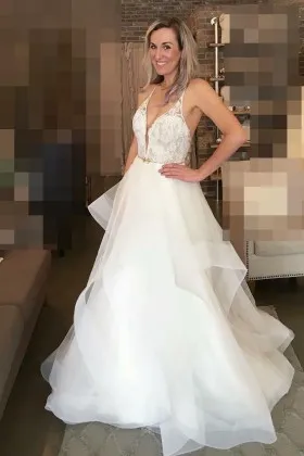 princess white lace and organza plunging V neckline flounced floor length wedding dress
