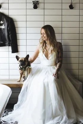 sleeveless plunging V neckline classic ivory floor length A line wedding dress