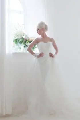 Sophisticated satin column wedding dress with detachable tulle overskirt