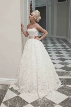 Stunning yet simple strapless ivory lace ballgown wedding dress
